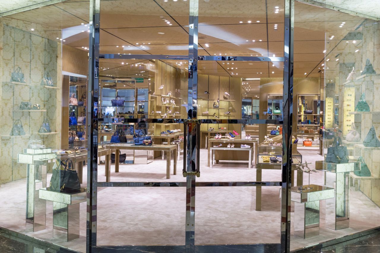 Upscale boutique with pristine floors and displays maintained by cleaning services for retail stores.