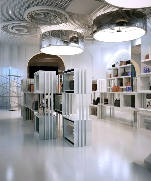 Immaculate luxury boutique with shiny floors, clean display units, and well-lit shelves—an ideal result of premium retail store cleaning services.