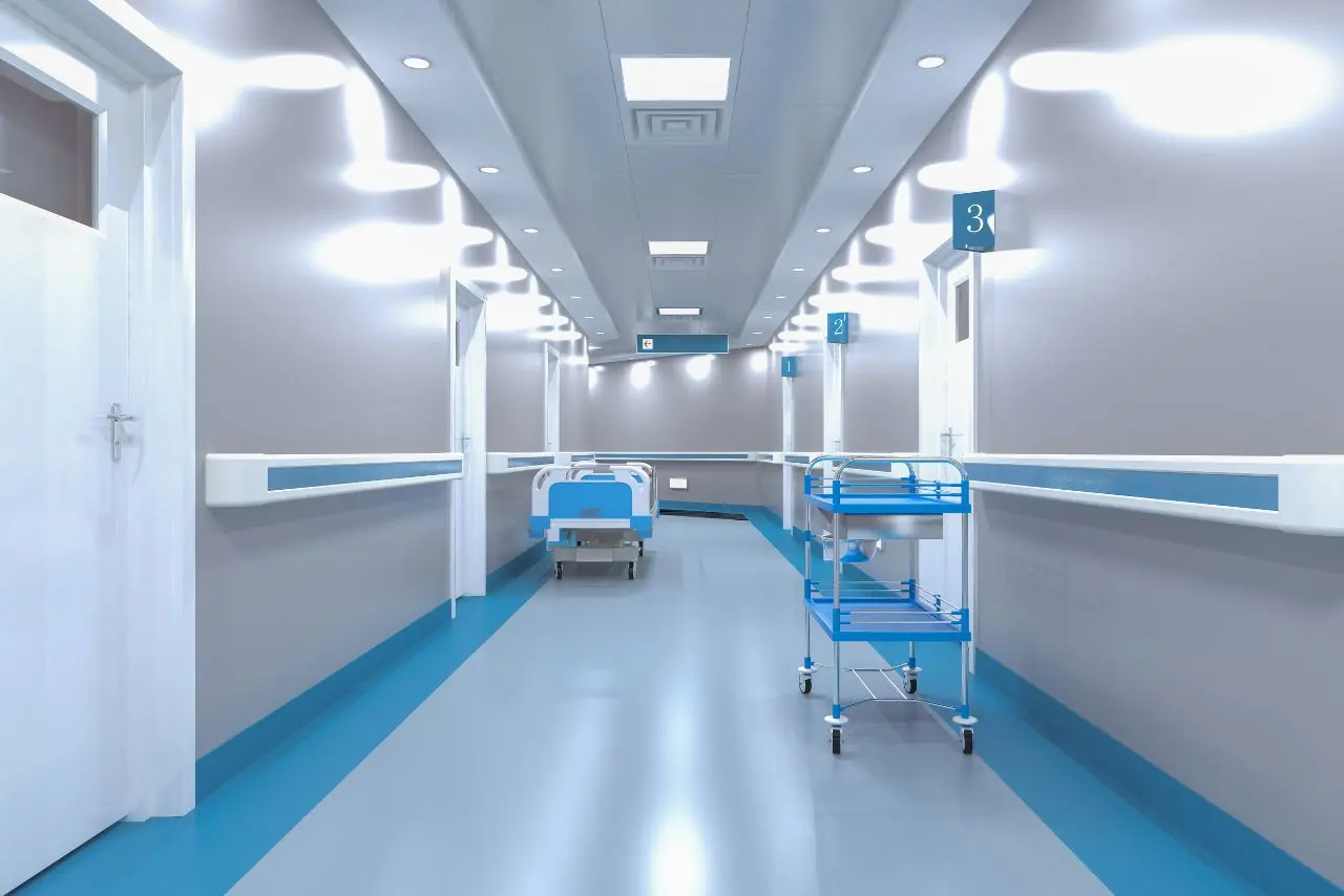 Sterile hospital hallway with clean floors and medical equipment, maintained by medical cleaning services NJ.
