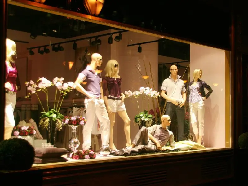 Mannequins in a polished storefront display maintained by retail cleaning services NJ.