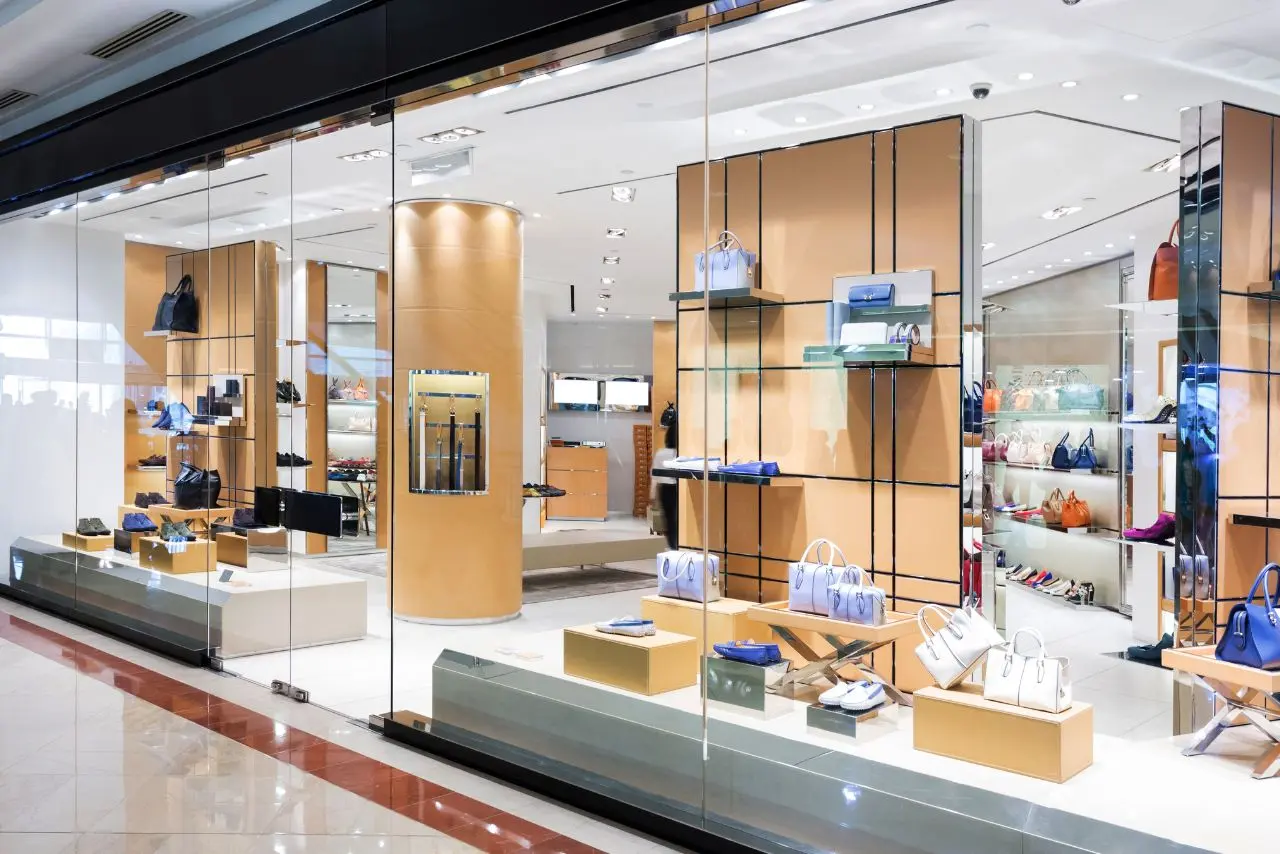 Glass-front luxury store with polished floors and spotless displays, showcasing the results of expert retail store cleaning services.
