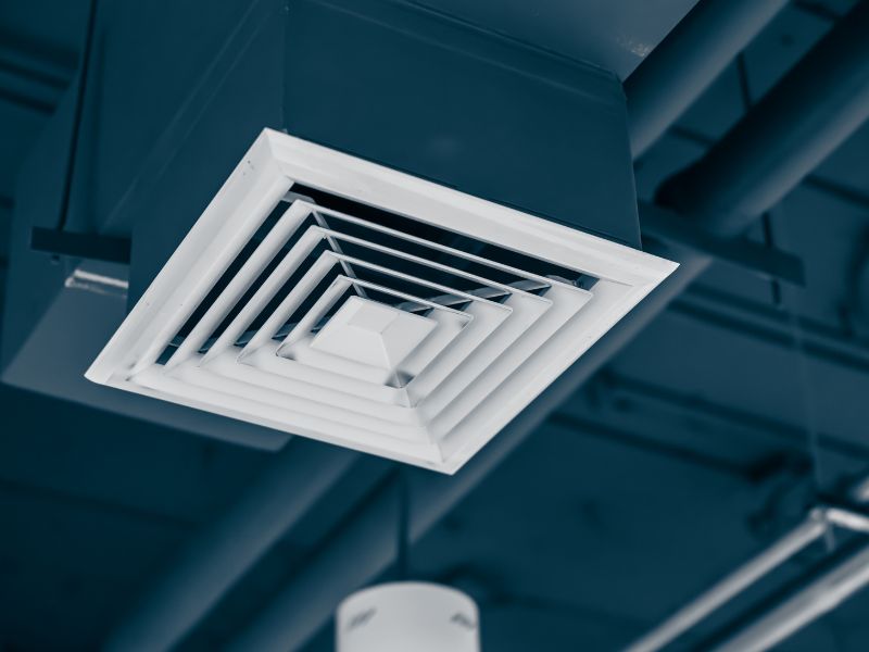 Ceiling air vent connected to an HVAC duct system, highlighting air distribution areas where dust accumulation can affect indoor air quality.