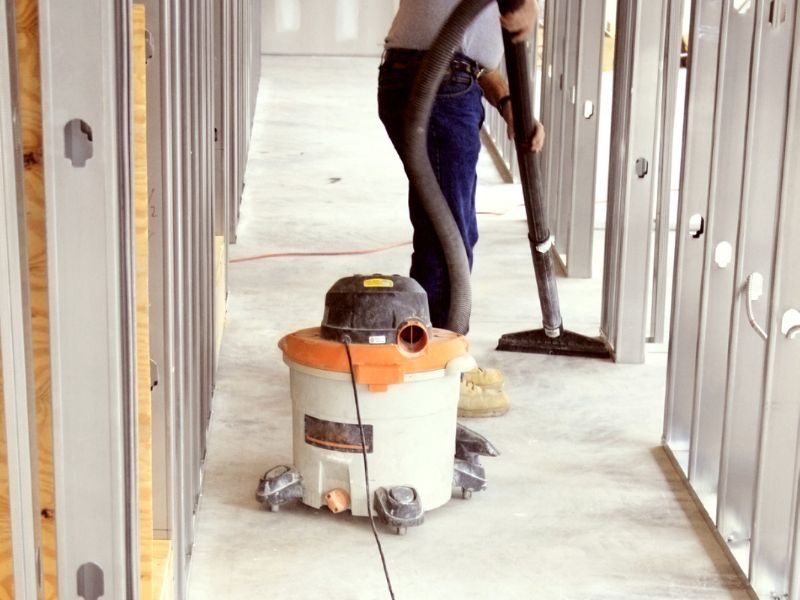 What does post-construction cleaning include?